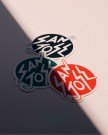 Close-up photo of a small stack of San Jose stickers